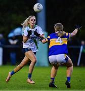 31 October 2021; Nicole Owens of St Sylvesters in action against Tara King of Castleknock during the Dublin LGFA Go-Ahead Intermediate Club Football Championship Final match between St Sylvesters and Castleknock at St Margarets GAA club in Dublin. Photo by Brendan Moran/Sportsfile