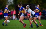 31 October 2021; Laura Carolan of Castleknock in action against Danielle Lawless of St Sylvesters during the Dublin LGFA Go-Ahead Intermediate Club Football Championship Final match between St Sylvesters and Castleknock at St Margarets GAA club in Dublin. Photo by Brendan Moran/Sportsfile