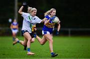 31 October 2021; Caitlin Coffey of Castleknock in action against Nicole Owens of St Sylvesters during the Dublin LGFA Go-Ahead Intermediate Club Football Championship Final match between St Sylvesters and Castleknock at St Margarets GAA club in Dublin. Photo by Brendan Moran/Sportsfile