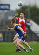 31 October 2021; Niall Daly of Pádraig Pearses in action against Sea Henry of Clann na nGael during the Roscommon County Senior Club Football Championship Final match between Clann na nGael and Padraig Pearses at Dr Hyde Park in Roscommon. Photo by Seb Daly/Sportsfile