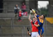 31 October 2021; Paul Carey of Pádraig Pearses in action against Fearghal Lennon of Clann na nGael during the Roscommon County Senior Club Football Championship Final match between Clann na nGael and Padraig Pearses at Dr Hyde Park in Roscommon. Photo by Seb Daly/Sportsfile