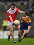 31 October 2021; Hubert Darcy of Pádraig Pearses in action against Jack Connaughton of Clann na nGael during the Roscommon County Senior Club Football Championship Final match between Clann na nGael and Padraig Pearses at Dr Hyde Park in Roscommon. Photo by Seb Daly/Sportsfile
