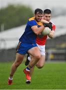 31 October 2021; David McManus of Clann na nGael in action against Conor Daly of Pádraig Pearses during the Roscommon County Senior Club Football Championship Final match between Clann na nGael and Padraig Pearses at Dr Hyde Park in Roscommon. Photo by Seb Daly/Sportsfile
