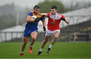 31 October 2021; David McManus of Clann na nGael in action against Conor Daly of Pádraig Pearses during the Roscommon County Senior Club Football Championship Final match between Clann na nGael and Padraig Pearses at Dr Hyde Park in Roscommon. Photo by Seb Daly/Sportsfile