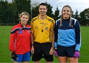 31 October 2021; Referee Ray McBride with team captains Caroline Roban of Clontarf B, left, and Aoife Keyes of St Jude's before the Dublin LGFA Go-Ahead Junior Club Football Championship Final match between Clontarf B and St Judes at St Margarets GAA club in Dublin. Photo by Brendan Moran/Sportsfile