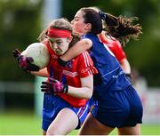 31 October 2021; Ciara O'Connor of Clontarf B is tackled by Aoife Walsh of St Jude's during the Dublin LGFA Go-Ahead Junior Club Football Championship Final match between Clontarf B and St Judes at St Margarets GAA club in Dublin. Photo by Brendan Moran/Sportsfile
