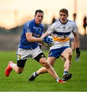 31 October 2021; Stephen McNally of Coalisland in action against Peter Harte of Errigal Ciaran during the Tyrone County Senior Football Championship Semi-Final match between Errigal Ciaran and Coalisland at Pomeroy Plunkett's GAA Club in Tyrone. Photo by Ramsey Cardy/Sportsfile