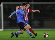 3 November 2021; Colm Whelan of UCD in action against Mark Walsh of Treaty United during the SSE Airtricity League First Division Play-Off Semi-Final 1st leg match between Treaty United and UCD at Markets Field in Limerick. Photo by Michael P Ryan/Sportsfile
