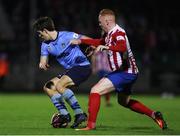 3 November 2021; Dara Keane of UCD in action against Kieran Hanlon of Treaty United during the SSE Airtricity League First Division Play-Off Semi-Final 1st leg match between Treaty United and UCD at Markets Field in Limerick. Photo by Michael P Ryan/Sportsfile