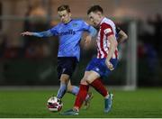 3 November 2021; Jack Lynch of Treaty United in action against Paul Doyle of UCD during the SSE Airtricity League First Division Play-Off Semi-Final 1st Leg match between Treaty United and UCD at Markets Field in Limerick. Photo by Michael P Ryan/Sportsfile