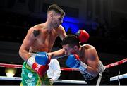 5 November 2021; James McGivern, left, and Rustem Fatkhullin during their lightweight bout at the Ulster Hall in Belfast. Photo by Ramsey Cardy/Sportsfile
