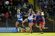 7 November 2021; Amy Gilsenan of Seneschalstown kicks a point under pressure from Honor Hickey of St Peter's Dunboyne during the Meath County Ladies Football Senior Club Championship Final match between St Peter's Dunboyne and Seneschalstown at Páirc Tailteann in Navan, Meath. Photo by Seb Daly/Sportsfile