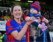 7 November 2021; St Peter's Dunboyne captain Fiona O’Neill and her 6-month old daughter Sadhbh celebrate with the Joe Breen trophy after their side's victory in the Meath County Ladies Football Senior Club Championship Final match between St Peter's Dunboyne and Seneschalstown at Páirc Tailteann in Navan, Meath. Photo by Seb Daly/Sportsfile