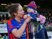 7 November 2021; St Peter's Dunboyne captain Fiona O’Neill and her 6-month old daughter Sadhbh celebrate with the Joe Breen trophy after their side's victory in the Meath County Ladies Football Senior Club Championship Final match between St Peter's Dunboyne and Seneschalstown at Páirc Tailteann in Navan, Meath. Photo by Seb Daly/Sportsfile
