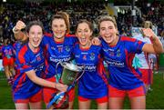 7 November 2021; St Peter's Dunboyne players, from left, Fiona O’Neill, Aoife Thompson, Dee Blaney and Julie Kavanagh celebrate with the Joe Breen trophy after their side's victory in the Meath County Ladies Football Senior Club Championship Final match between St Peter's Dunboyne and Seneschalstown at Páirc Tailteann in Navan, Meath. Photo by Seb Daly/Sportsfile