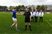 7 November 2021; Match referee Derek Ryan with Naomh Mairtin captain Sam Mulroy before the Louth County Senior Club Football Championship Final match between Naomh Mairtin and St Mochta’s at Páirc Mhuire in Ardee, Louth. Photo by Ray McManus/Sportsfile
