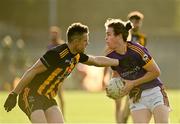 7 November 2021; Oisín Martin of Wolfe Tones in action against Stuart Lowndes of St Peter's Dunboyne during the Meath County Senior Club Football Championship Final match between St Peter's Dunboyne and Wolfe Tones at Páirc Tailteann in Navan, Meath. Photo by Seb Daly/Sportsfile