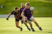 7 November 2021; Oisín Martin of Wolfe Tones in action against Gavin McCoy of St Peter's Dunboyne during the Meath County Senior Club Football Championship Final match between St Peter's Dunboyne and Wolfe Tones at Páirc Tailteann in Navan, Meath. Photo by Seb Daly/Sportsfile