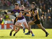 7 November 2021; Thomas O’Reilly of Wolfe Tones in action against Sean Ryan, left, and Shane McEntee of St Peter's Dunboyne during the Meath County Senior Club Football Championship Final match between St Peter's Dunboyne and Wolfe Tones at Páirc Tailteann in Navan, Meath. Photo by Seb Daly/Sportsfile