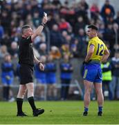 7 November 2021; Match referee Derek Ryan issues a 'black card' to Danny Kindlon of St Mochta’s during the Louth County Senior Club Football Championship Final match between Naomh Mairtin and St Mochta’s at Páirc Mhuire in Ardee, Louth. Photo by Ray McManus/Sportsfile