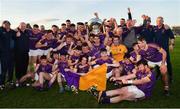 7 November 2021; Wolfe Tones players celebrate with the trophy after their side's victory in the Meath County Senior Club Football Championship Final match between St Peter's Dunboyne and Wolfe Tones at Páirc Tailteann in Navan, Meath. Photo by Seb Daly/Sportsfile