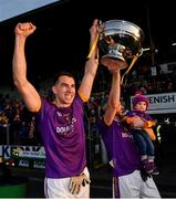 7 November 2021; Wolfe Tones joint captain Shane Glynn, left, and Cian Ward lift the trophy after their side's victory in the Meath County Senior Club Football Championship Final match between St Peter's Dunboyne and Wolfe Tones at Páirc Tailteann in Navan, Meath. Photo by Seb Daly/Sportsfile