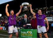 7 November 2021; Wolfe Tones joint captains Cian Ward, left, and Shane Glynn lift the trophy after their side's victory in the Meath County Senior Club Football Championship Final match between St Peter's Dunboyne and Wolfe Tones at Páirc Tailteann in Navan, Meath. Photo by Seb Daly/Sportsfile