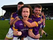 7 November 2021; Wolfe Tones players Oisín Martin, centre, Sarán Ó Fionnagáin, behind, and Brughach Ó Fionnagáin celebrate after their side's victory in the Meath County Senior Club Football Championship Final match between St Peter's Dunboyne and Wolfe Tones at Páirc Tailteann in Navan, Meath. Photo by Seb Daly/Sportsfile