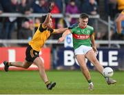 7 November 2021; Tiernan Madden of Gowna with a late shot under pressure from Mark Magee of Ramor United during the Cavan County Senior Club Football Championship Final match between Gowna and Ramor United at Kingspan Breffni in Cavan. Photo by Oliver McVeigh/Sportsfile