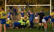 7 November 2021; Referee Derek Ryan, St Mochta’s manager Kieran Quinn, players and officials look on as Stephen McCooey of St Mochta’s is atteded to by medical personnel in the last few minutes of the Louth County Senior Club Football Championship Final match between Naomh Mairtin and St Mochta’s at Páirc Mhuire in Ardee, Louth. Photo by Ray McManus/Sportsfile