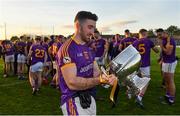 7 November 2021; Caolán Ward of Wolfe Tones with the trophy after his side's victory in the Meath County Senior Club Football Championship Final match between St Peter's Dunboyne and Wolfe Tones at Páirc Tailteann in Navan, Meath. Photo by Seb Daly/Sportsfile