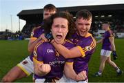 7 November 2021; Wolfe Tones players Oisín Martin, centre, Sarán Ó Fionnagáin, behind, and Brughach Ó Fionnagáin celebrate after their side's victory in the Meath County Senior Club Football Championship Final match between St Peter's Dunboyne and Wolfe Tones at Páirc Tailteann in Navan, Meath. Photo by Seb Daly/Sportsfile