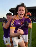 7 November 2021; Wolfe Tones players Oisín Martin, centre, Sarán Ó Fionnagáin, left, and Brughach Ó Fionnagáin celebrates after their side's victory in the Meath County Senior Club Football Championship Final match between St Peter's Dunboyne and Wolfe Tones at Páirc Tailteann in Navan, Meath. Photo by Seb Daly/Sportsfile