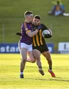 7 November 2021; David McEntee of St Peter's Dunboyne in action against Niall O’Reilly of Wolfe Tones during the Meath County Senior Club Football Championship Final match between St Peter's Dunboyne and Wolfe Tones at Páirc Tailteann in Navan, Meath. Photo by Seb Daly/Sportsfile