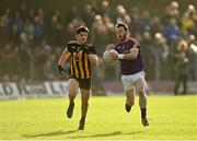 7 November 2021; Stephen Sheppard of Wolfe Tones in action against Seamus Lavin of St Peter's Dunboyne during the Meath County Senior Club Football Championship Final match between St Peter's Dunboyne and Wolfe Tones at Páirc Tailteann in Navan, Meath. Photo by Seb Daly/Sportsfile