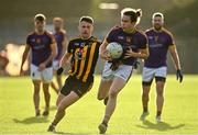 7 November 2021; Oisín Martin of Wolfe Tones in action against Stuart Lowndes of St Peter's Dunboyne during the Meath County Senior Club Football Championship Final match between St Peter's Dunboyne and Wolfe Tones at Páirc Tailteann in Navan, Meath. Photo by Seb Daly/Sportsfile