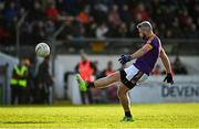 7 November 2021; Cian Ward of Wolfe Tones kicks a point during the Meath County Senior Club Football Championship Final match between St Peter's Dunboyne and Wolfe Tones at Páirc Tailteann in Navan, Meath. Photo by Seb Daly/Sportsfile