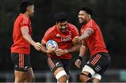11 November 2021; Akira Ioane, centre, is tackled by Rieko Ioane, left, and Ardie Savea during a New Zealand All Blacks rugby squad training at UCD Bowl in Dublin. Photo by Sam Barnes/Sportsfile