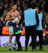 11 November 2021; Cristiano Ronaldo of Portugal gives his jersey to Republic of Ireland supporter, Addison Whelan, after the FIFA World Cup 2022 qualifying group A match between Republic of Ireland and Portugal at the Aviva Stadium in Dublin. Photo by Stephen McCarthy/Sportsfile