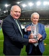11 November 2021; FAI president Gerry McAnaney, left, presents the Hall of Fame award to former Republic of Ireland international John Giles during the FIFA World Cup 2022 qualifying group A match between Republic of Ireland and Portugal at the Aviva Stadium in Dublin. Photo by Seb Daly/Sportsfile