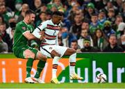 11 November 2021; Nélson Semedo of Portugal in action against Enda Stevens of Republic of Ireland during the FIFA World Cup 2022 qualifying group A match between Republic of Ireland and Portugal at the Aviva Stadium in Dublin. Photo by Stephen McCarthy/Sportsfile