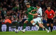 11 November 2021; Callum Robinson of Republic of Ireland in action against Joao Palhinha of Portugal during the FIFA World Cup 2022 qualifying group A match between Republic of Ireland and Portugal at the Aviva Stadium in Dublin. Photo by Stephen McCarthy/Sportsfile