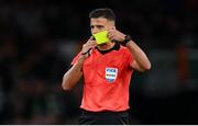 11 November 2021; Referee Jesús Gil Manzano issues a yellow card during the FIFA World Cup 2022 qualifying group A match between Republic of Ireland and Portugal at the Aviva Stadium in Dublin. Photo by Stephen McCarthy/Sportsfile