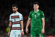 11 November 2021; John Egan of Republic of Ireland and Bruno Fernandes of Portugal during the FIFA World Cup 2022 qualifying group A match between Republic of Ireland and Portugal at the Aviva Stadium in Dublin. Photo by Stephen McCarthy/Sportsfile
