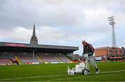 12 November 2021; Bohemians groundskeeper Derek Beauchamp tops up the paint on the pitch before the SSE Airtricity League Premier Division match between Bohemians and Shamrock Rovers at Dalymount Park in Dublin. Photo by Ramsey Cardy/Sportsfile