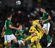 12 November 2021; Jonny Evans of Northern Ireland wins a header ahead of Karolis Laukžemis of Lithuania during the FIFA World Cup 2022 qualifying group C match between Northern Ireland and Lithuania at National Football Stadium, Windsor Park in Belfast. Photo by David Fitzgerald/Sportsfile