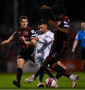12 November 2021; Danny Mandroiu of Shamrock Rovers in action against Keith Buckley, left, and Promise Omochere of Bohemians during the SSE Airtricity League Premier Division match between Bohemians and Shamrock Rovers at Dalymount Park in Dublin. Photo by Ramsey Cardy/Sportsfile