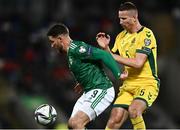 12 November 2021; Conor Washington of Northern Ireland in action against Martynas Dapkus of Lithuania during the FIFA World Cup 2022 qualifying group C match between Northern Ireland and Lithuania at National Football Stadium, Windsor Park in Belfast. Photo by David Fitzgerald/Sportsfile