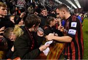 12 November 2021; Liam Burt of Bohemians signs autographs for supporters after the SSE Airtricity League Premier Division match between Bohemians and Shamrock Rovers at Dalymount Park in Dublin. Photo by Seb Daly/Sportsfile