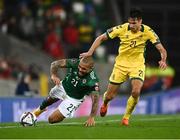 12 November 2021; Josh Magennis of Northern Ireland in action against Dominykas Barauskas of Lithuania during the FIFA World Cup 2022 qualifying group C match between Northern Ireland and Lithuania at National Football Stadium, Windsor Park in Belfast. Photo by David Fitzgerald/Sportsfile